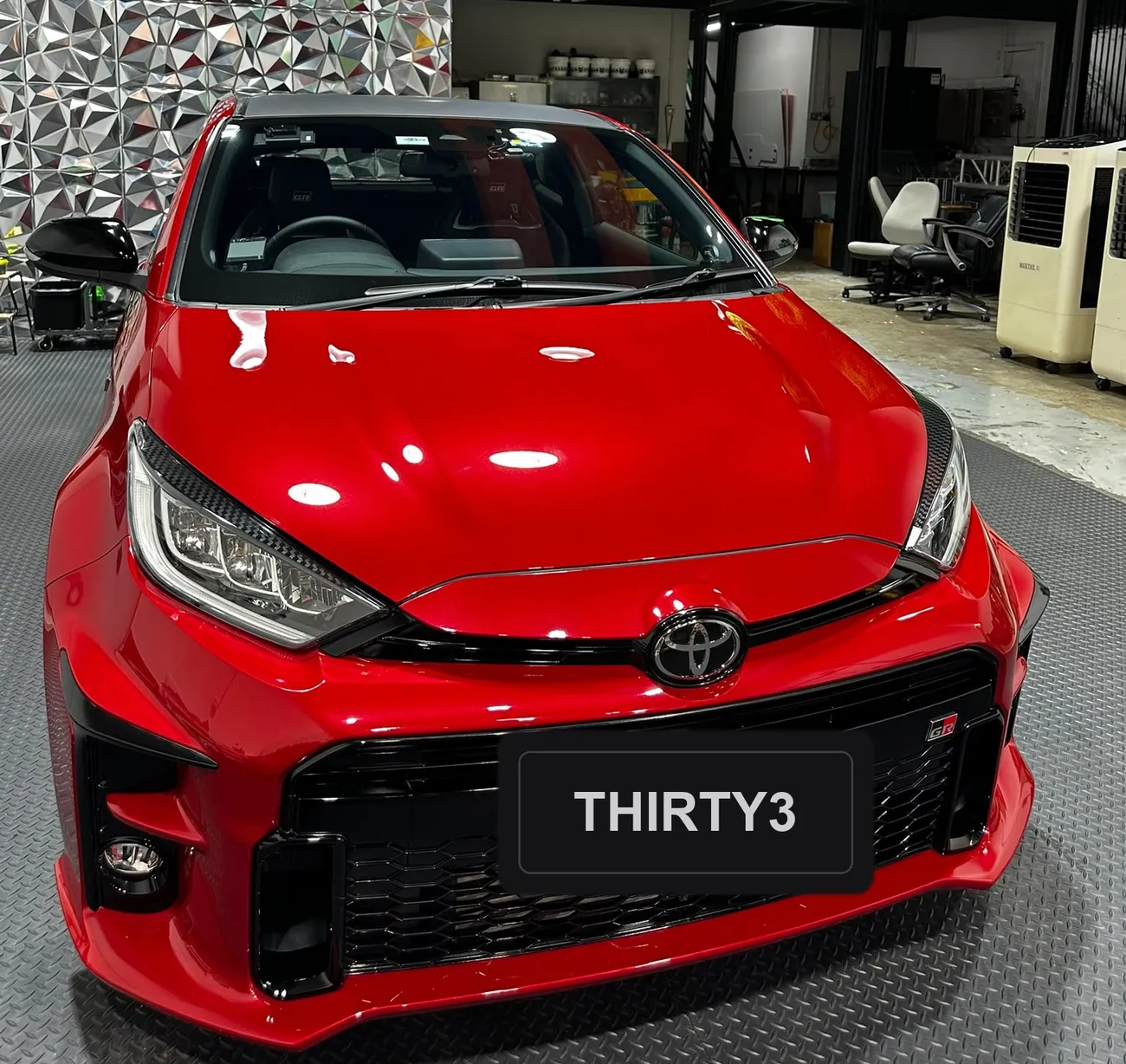 Toyota GR Yaris with a machine-polished, mirror-finish bonnet at the detailing studio